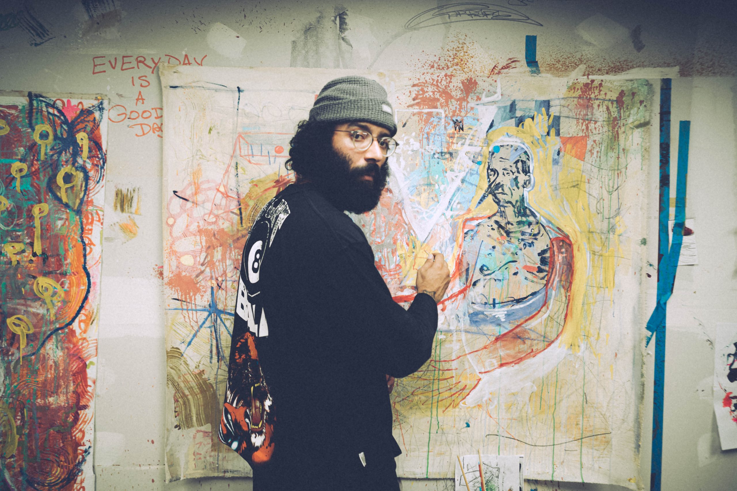 an artist in front of his canvass